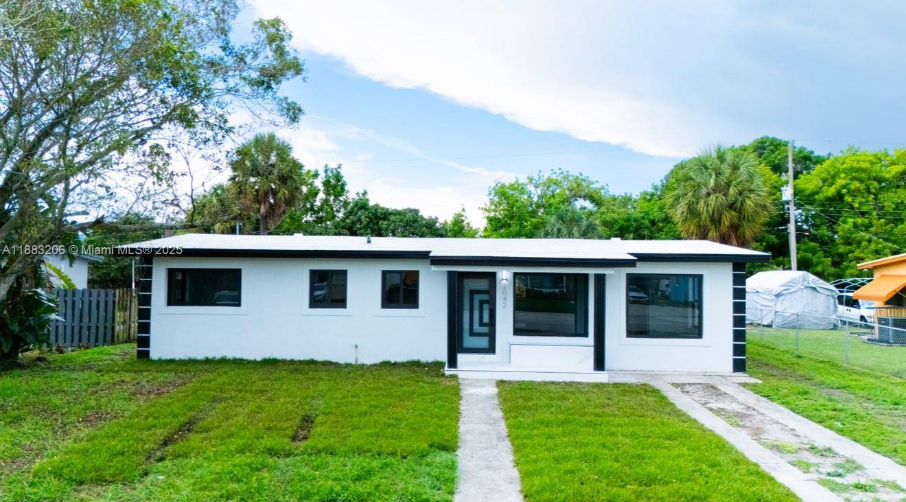 Stunning modern style home featuring 4 bedrooms and 3 bathrooms, including two spacious master suites.