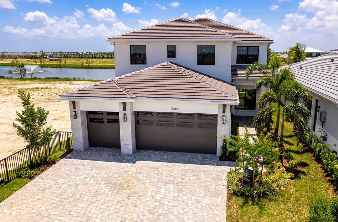 This professionally decorated Santa Monica model home at Solana Bay in Avenir is a dream come true, embodying the best of the Florida lifestyle.