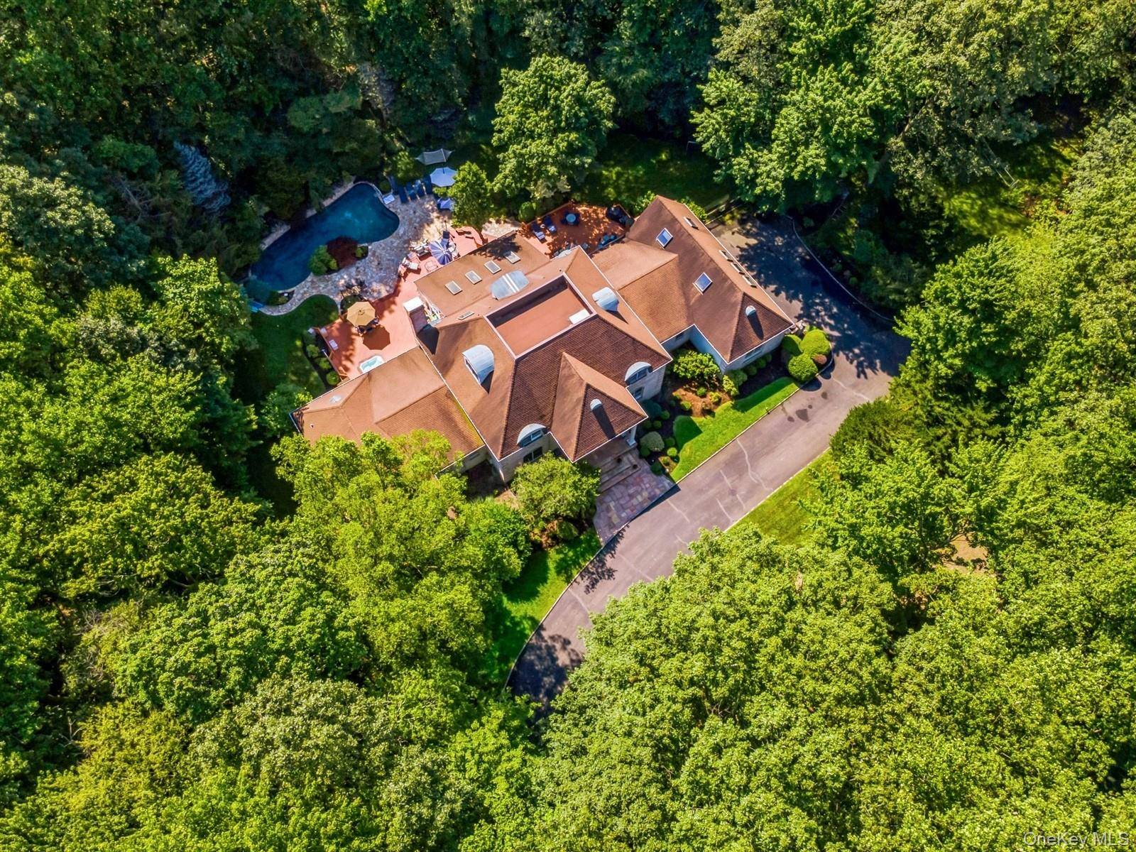 Welcome to this renovated, move in ready private sanctuary at 9 Swan Place, Nissequogue, just steps from Stony Brook Harbor, a masterfully designed estate offering elegance and modernity in over ...