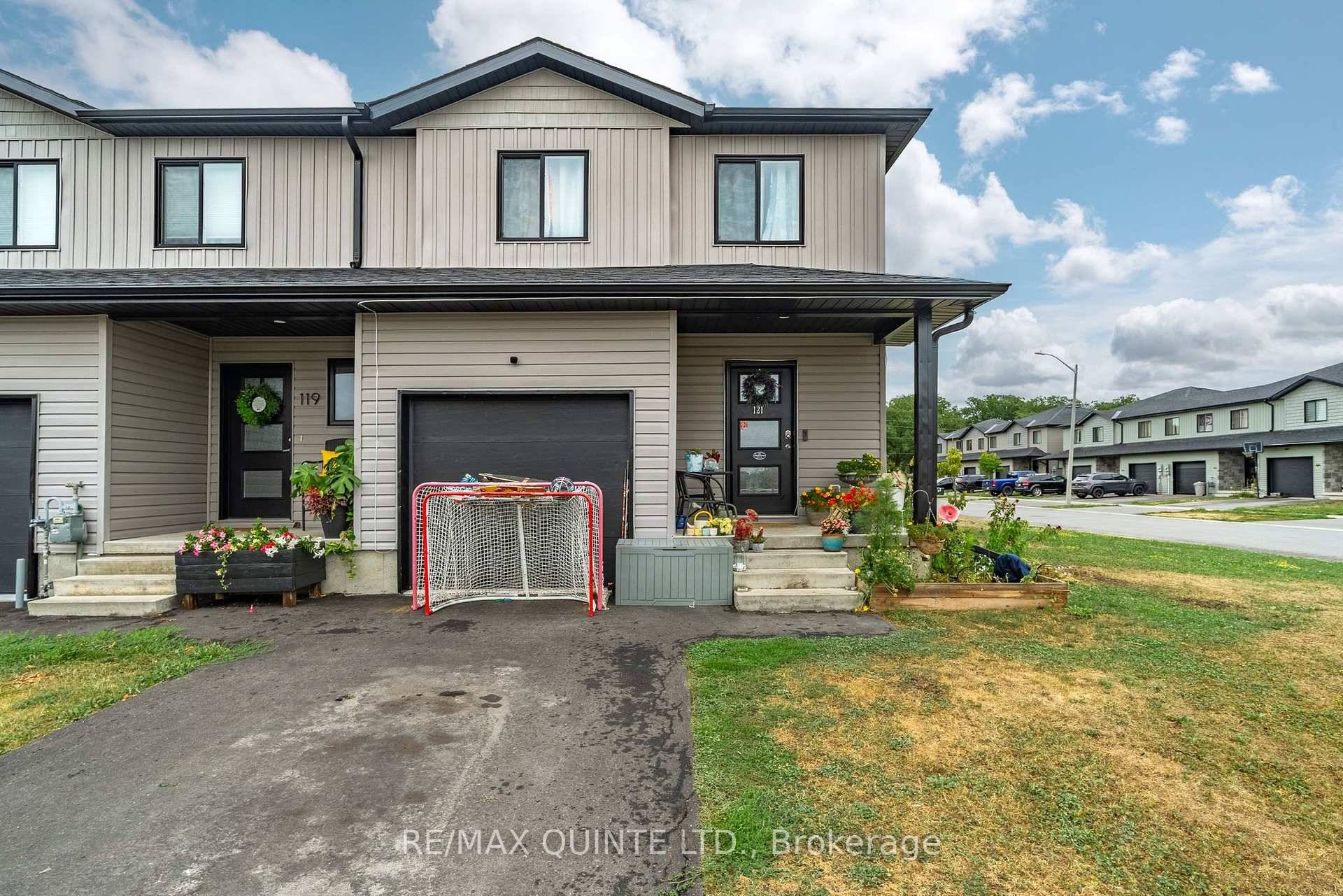 Modern 2 storey townhouse on a spacious corner lot with a fully fenced backyard and attached garage.