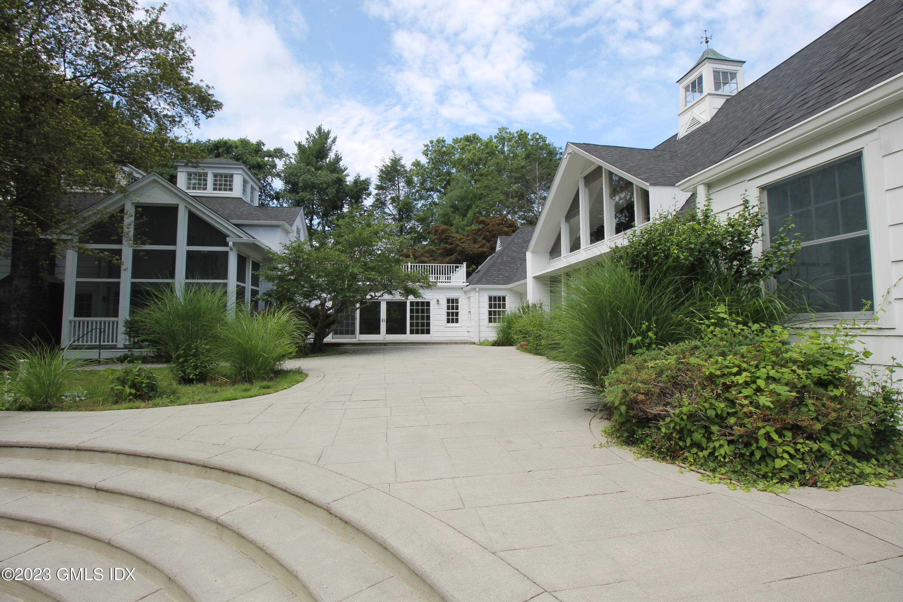 REDUCED INCREDIBLE VALUE IN THE HEART OF DARIEN Presiding majestically in its serene pvt setting on over 2.