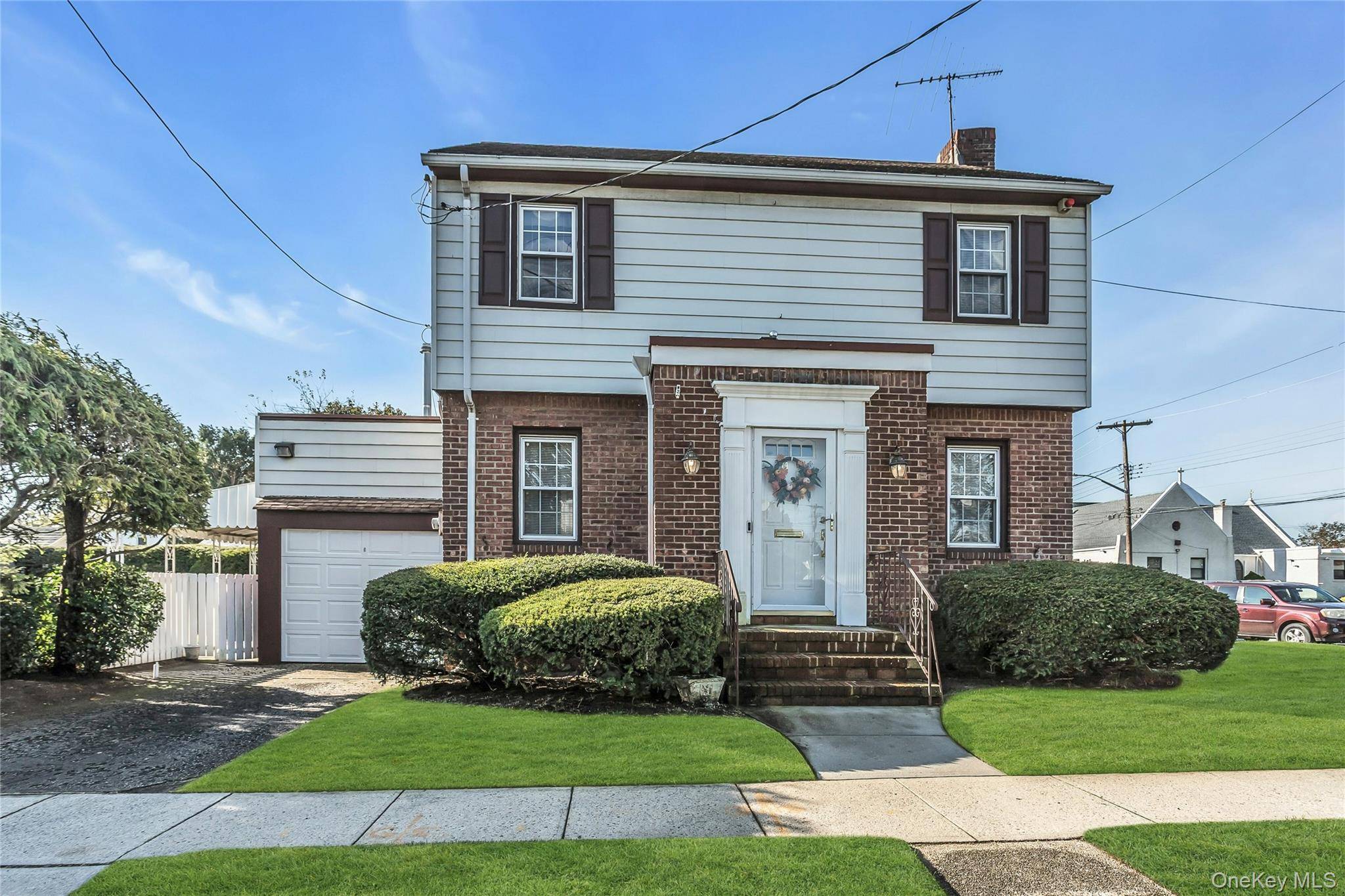 Charming Brick and Vinyl Colonial on a Corner Property !