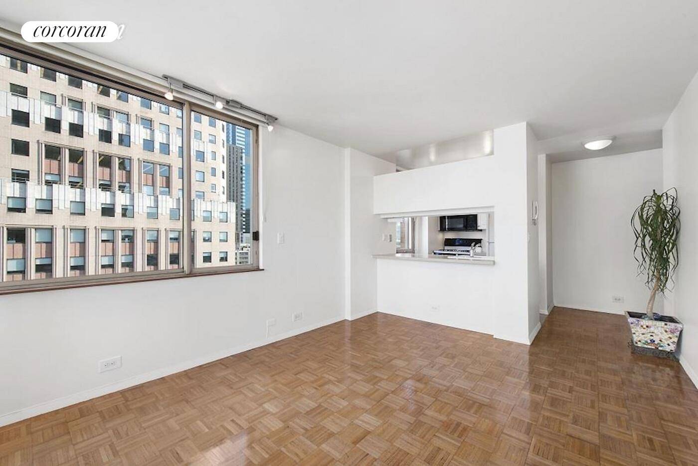 Residence 18i at 350 West 5oth Street is a sunny corner one bedroom with spectacular unobstructed North East views of the Manhattan skyline.