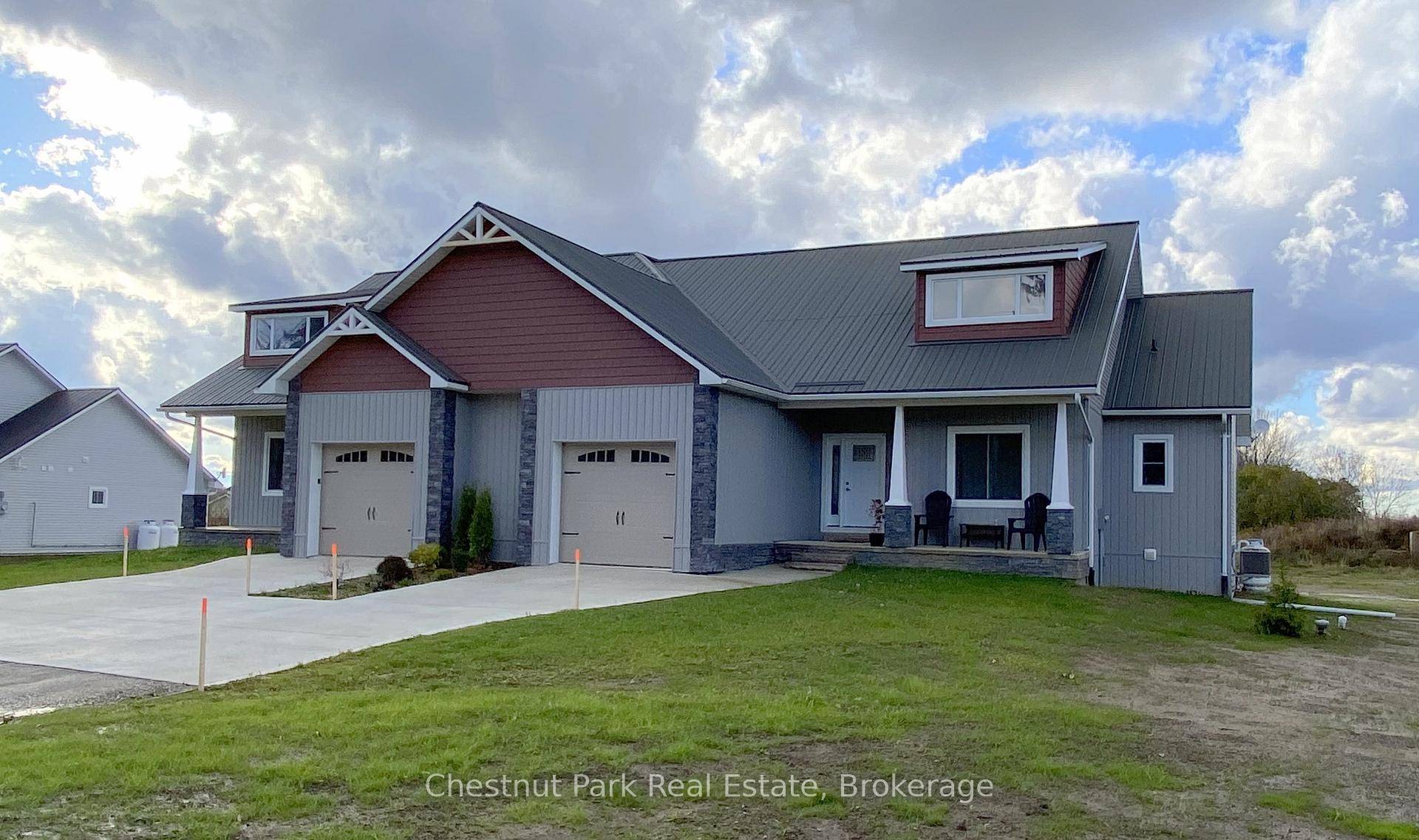 This Craftsman design features a covered main entry porch leading to an open concept floorplan displaying the abundance of space and revealing country views from the dining room terrace door.