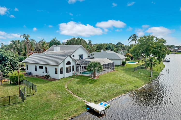 Fully Remodeled Lake Wellington waterfront home with 6 bedrooms, 4 bathrooms, and beautiful sunset views.