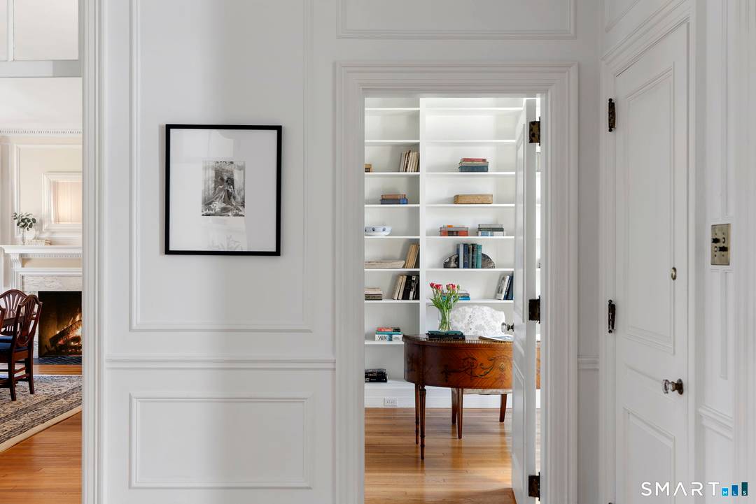 Characterized by stately facades, classic columns, and beautifully detailed doorways, this exceptional Colonial Revival residence at 85 Bloomfield Avenue captures timeless elegance and architectural distinction.