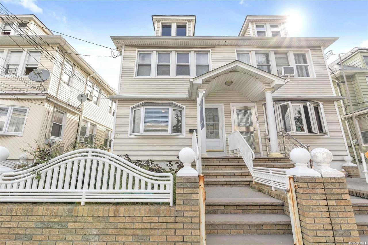 Welcome to this beautifully updated two family home, perfectly situated on a 21 x 100 ft lot on a charming tree lined block in the heart of Richmond Hill.