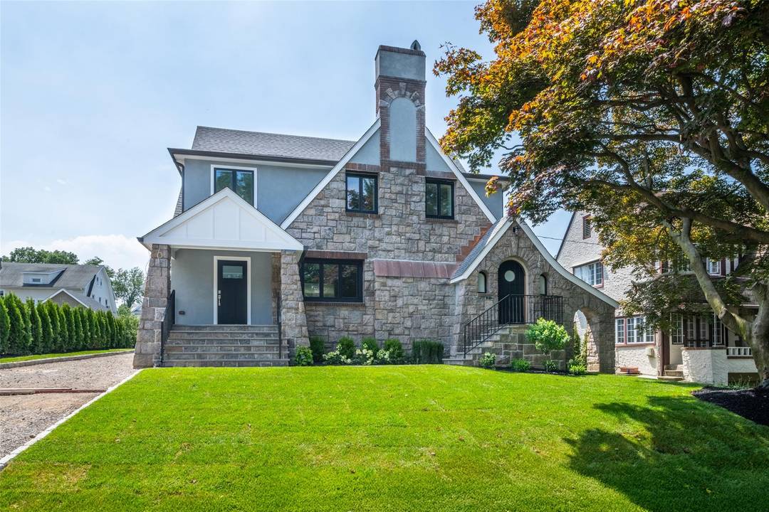 Welcome to this beautifully transformed tudor in the heart of New Rochelle, offering an exceptional blend of classic character and contemporary sophistication.