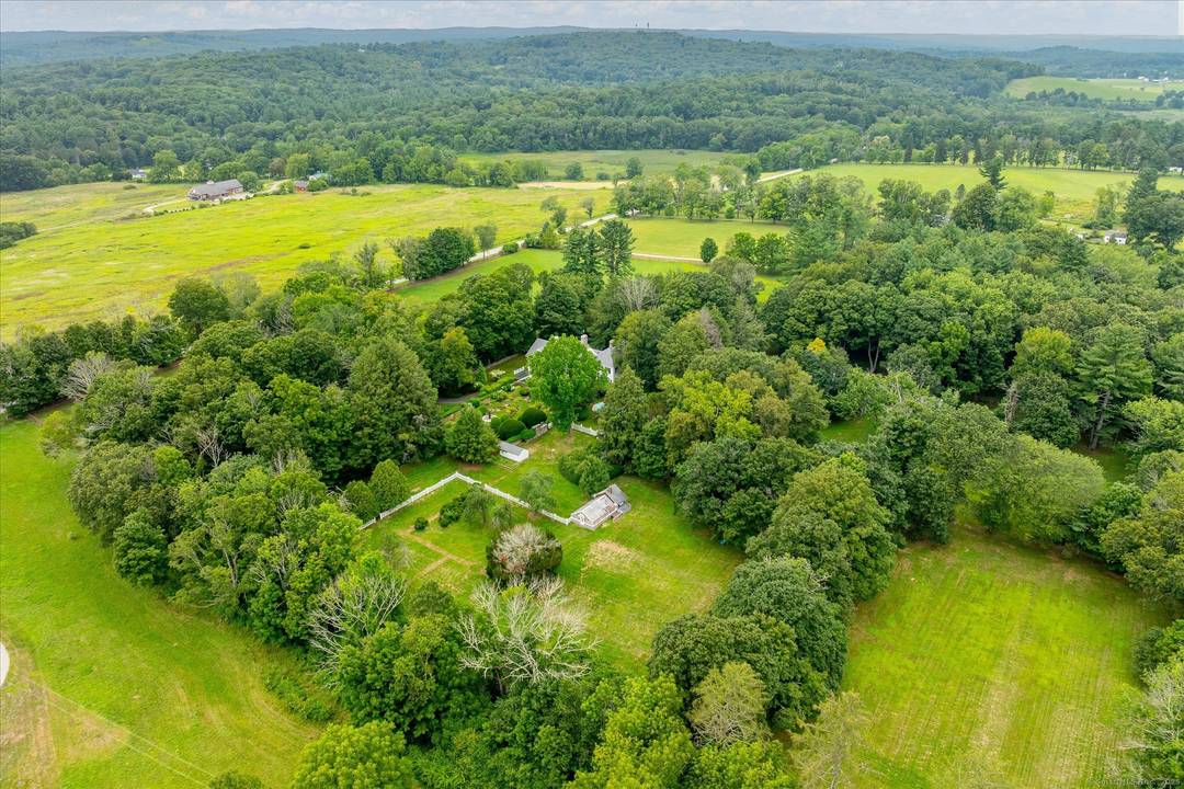 Reimagined in the early 1900s and surrounded by natural beauty, this extraordinary 41 acre estate offers unmatched privacy, timeless architecture, and refined craftsmanship.