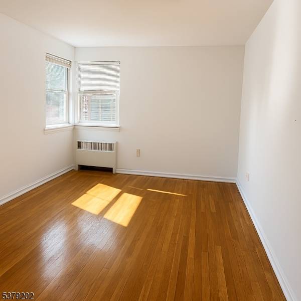 OVERSIZED 904 sq ft, first floor, south facing, end unit condo with plenty of closet space in the heart of Jersey City's desirable McGinley Square.