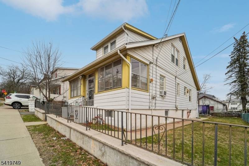 Great two family home featuring a welcoming enclosed front porch that leads to the first floor unit, offering a Living room, Eat in kitchen with pantry, two Bedrooms, and Full ...