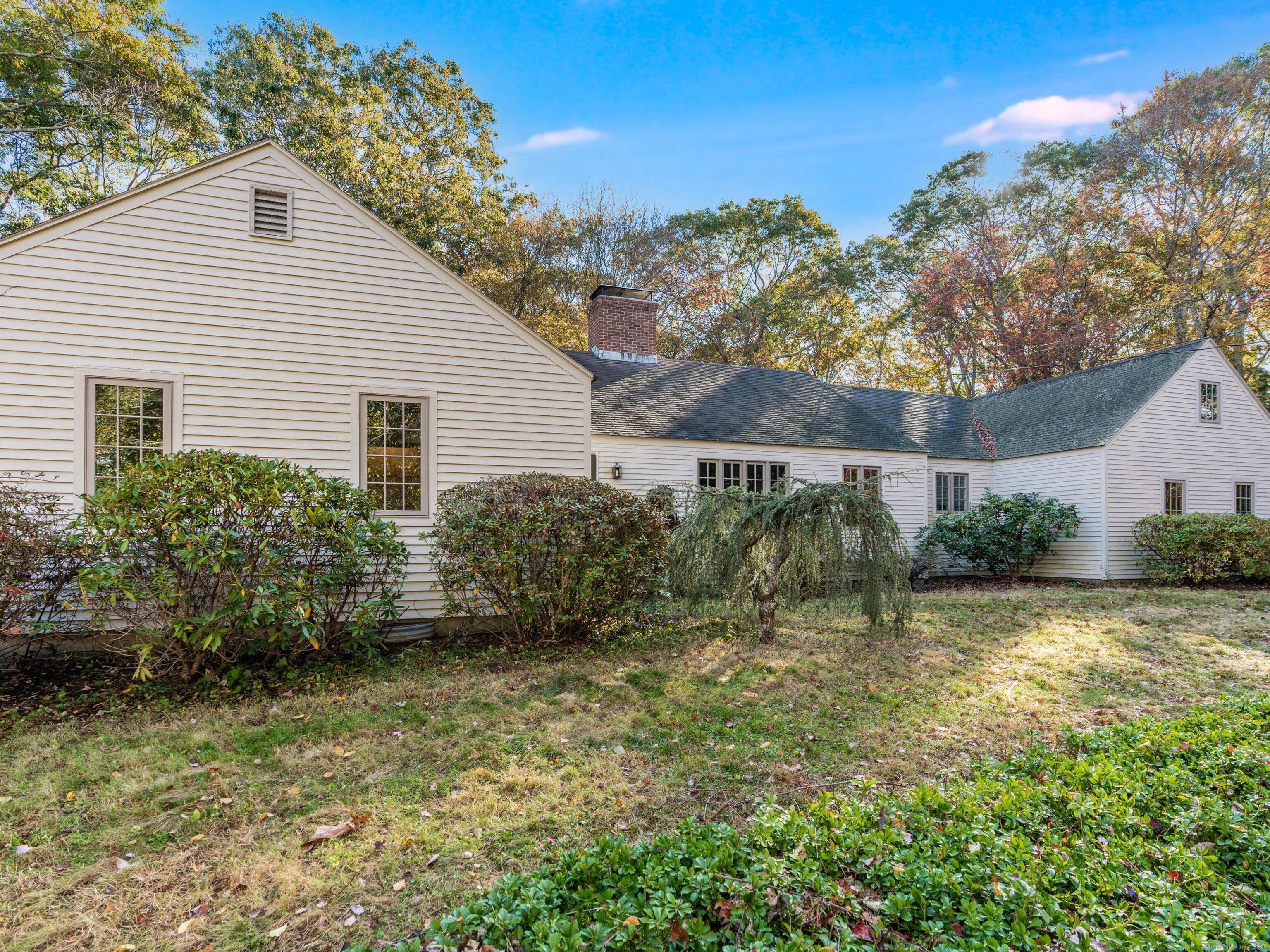 Nestled at the end of a peaceful cul de sac in the heart of Old Lyme, this elegant Colonial Cape residence blends timeless New England charm with refined sophistication.