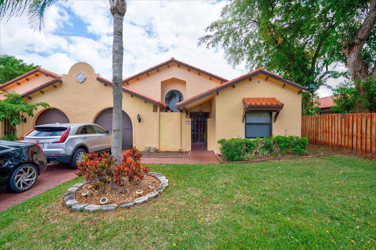 Imagine a tranquil retreat just minutes from the vibrant heart of Delray Beach.