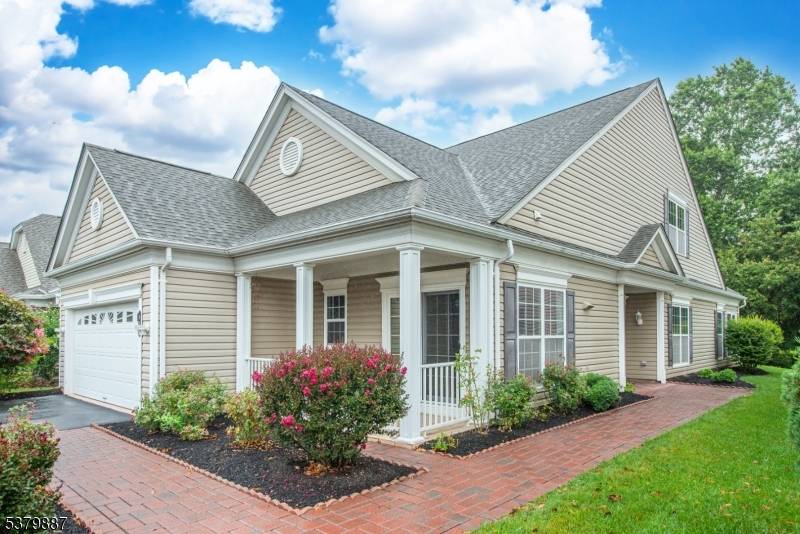 Nestled on a quiet, cul de sac street, this upgraded Astor Model w Sunroom Loft backs to woods !