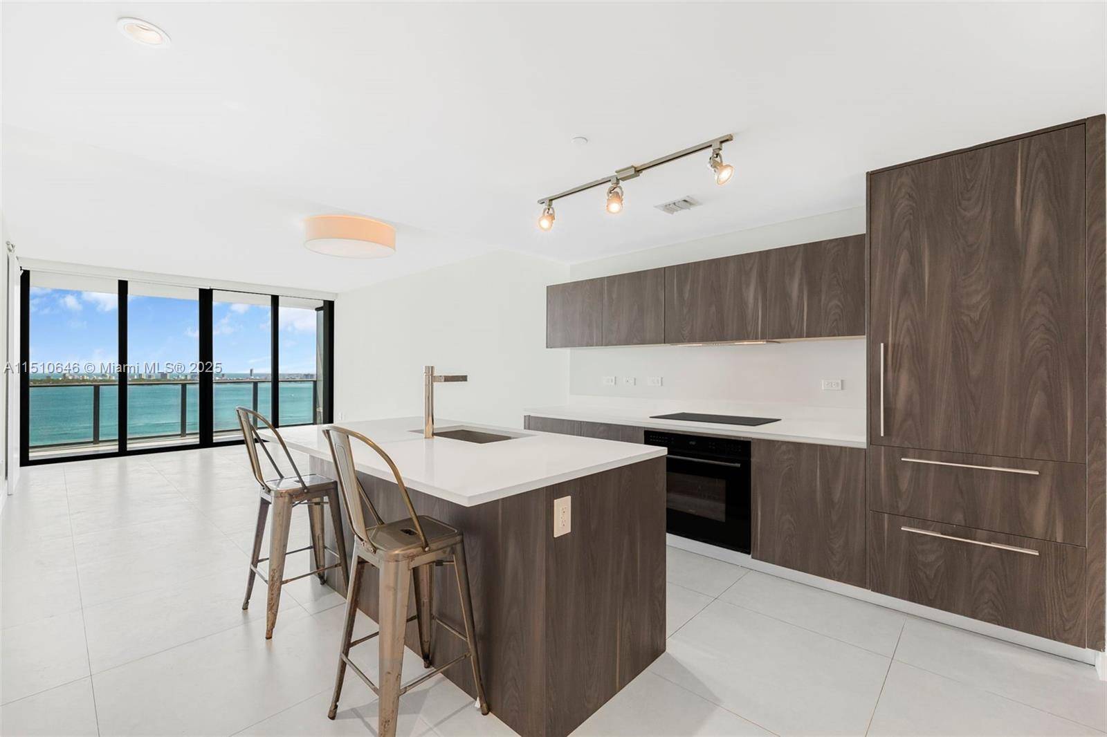 Private elevator foyer, Italian ceramic floors and breathtaking panoramic views of Biscayne Bay and Miami Beach in this spacious 1 bedroom, 1.