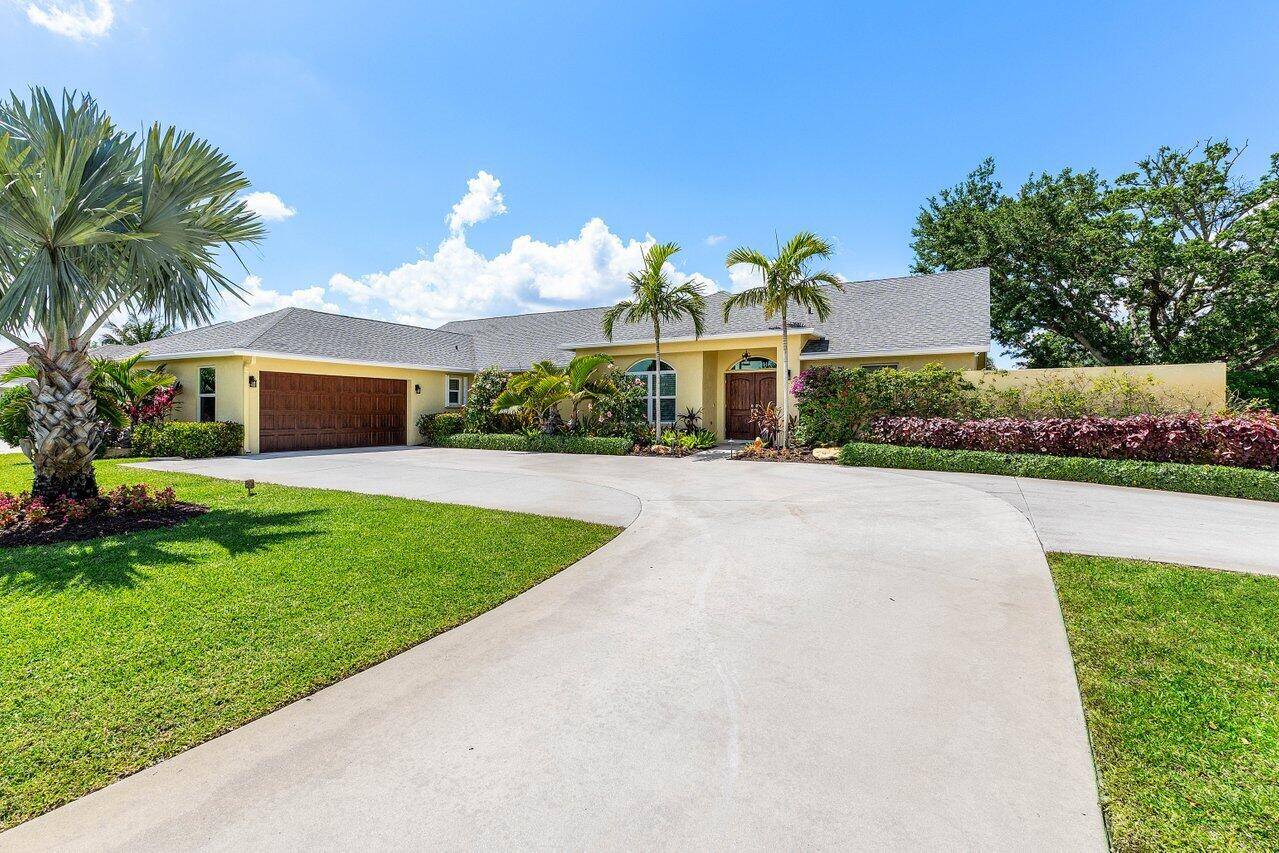 Don't miss an incredible opportunity to own this Wellington pool home on just over half an acre featuring a GREAT in law guest suite adding an additional bedroom, full bathroom ...