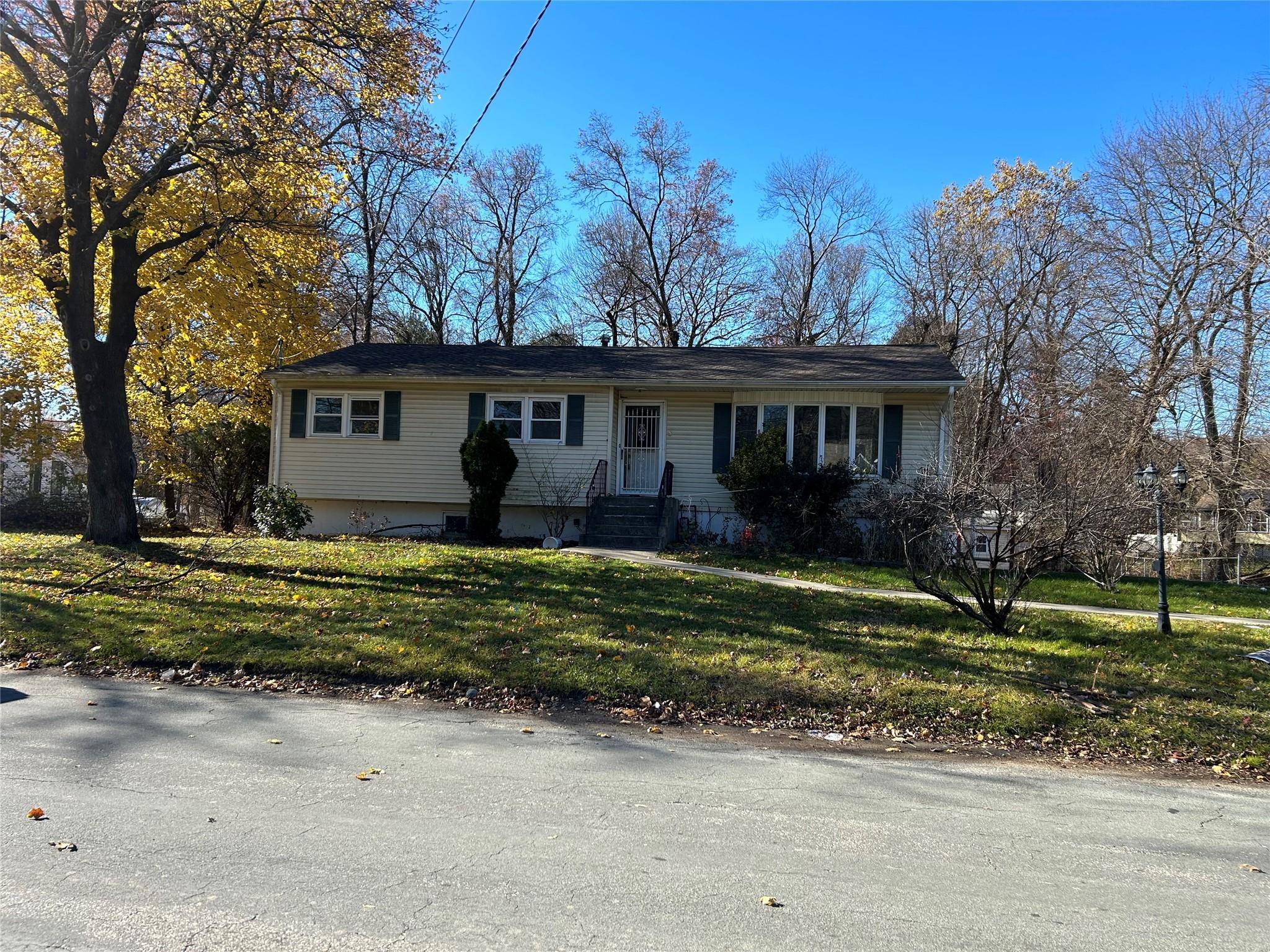 Large ranch with full finished basement with massive driveway and a large private backyard to accommodate your extended family.