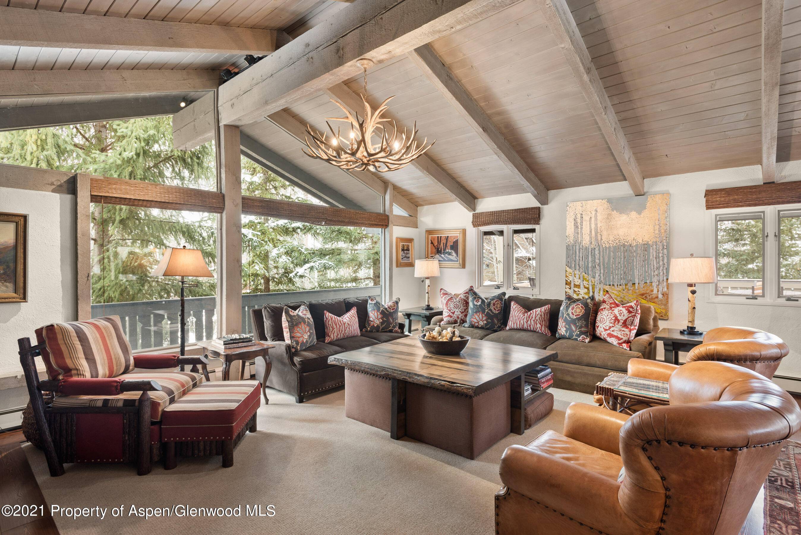 Relax by the firepit on the large deck while taking in the views of aspen mountain.