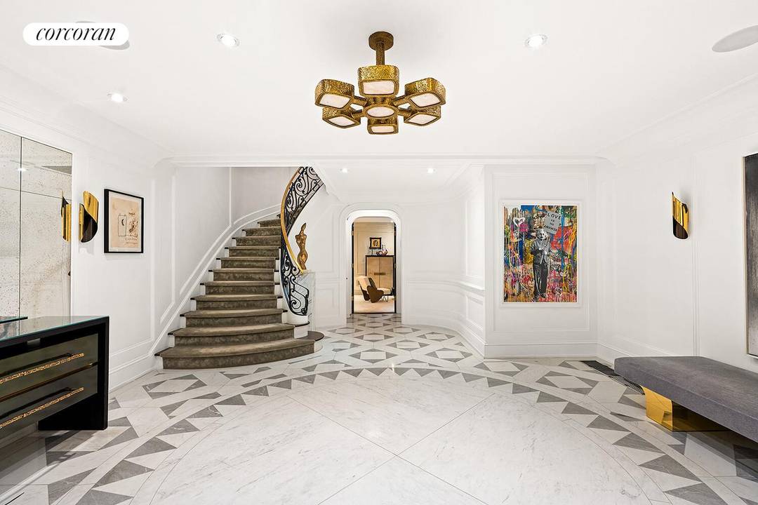 Move in ready and thoughtfully designed for modern townhouse living, this exceptional single family residence offers a seamless blend of historic character and contemporary comfort.