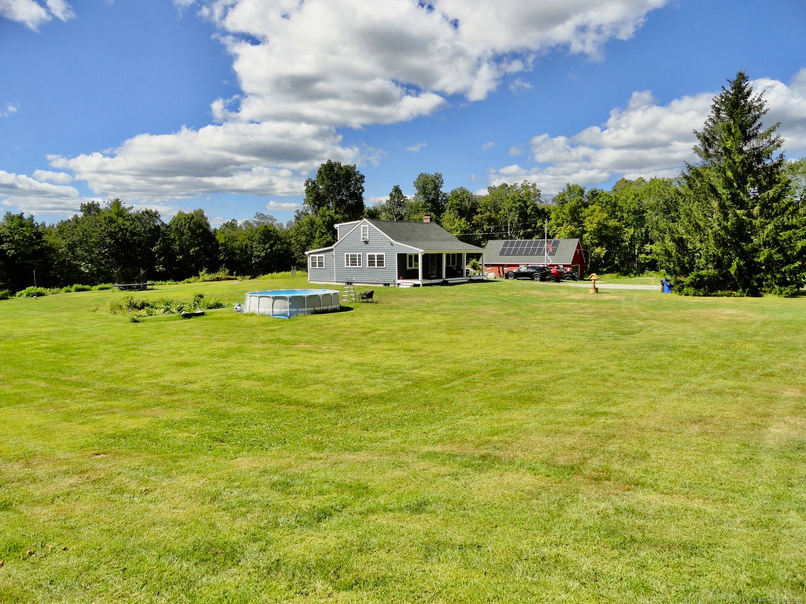 This 1950 Country Farmhouse with awesome Westerly views is a 4 bedroom cape with hardwood floors thru out and has an open floor plan.
