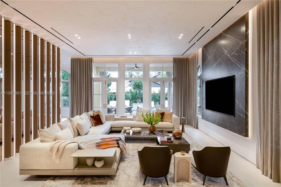 Located in the exclusive gated enclave of Villa Flora in Williams Island, this architectural masterpiece has undergone a meticulous transformation by Troy Dean Homes.