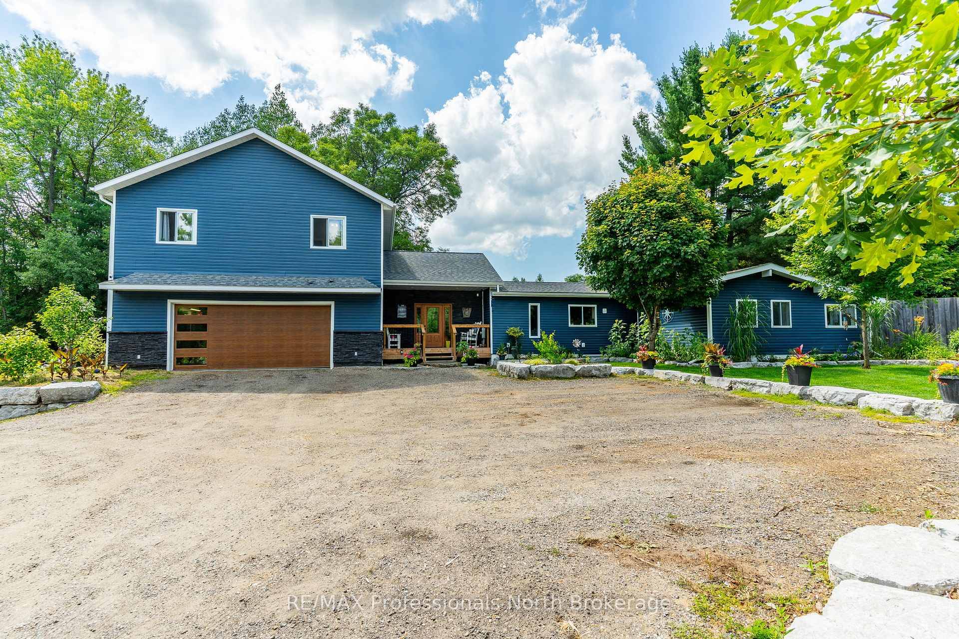 Welcome to this stunning executive home located on a quiet road with shared deeded access to the Gull River !