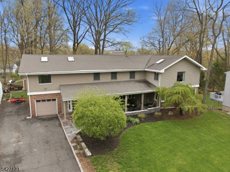 Experience this MASSIVE Colonial Expanded Ranch residence situated in highly sought after White Meadow Lake community within walking distance to your very own private Beach and just 1 hour to ...