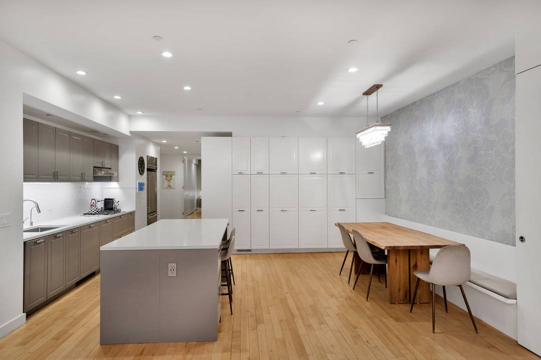 Welcome to Apartment 1824 at 15 Broad Street, an expansive loft residence thoughtfully redesigned to balance grand scale with exceptional functionality.