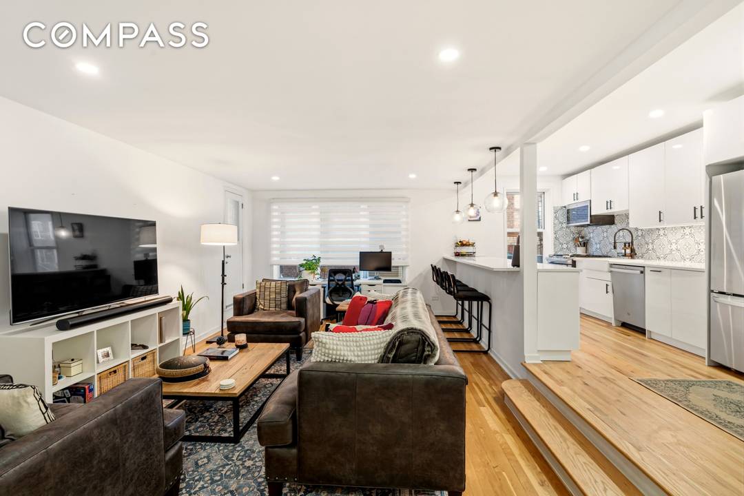 Fully Renovated 2nd floor corner residence with private terrace, skyline garden views, and optional garage parking, located at Terrace View in the Jackson Heights Historic District.