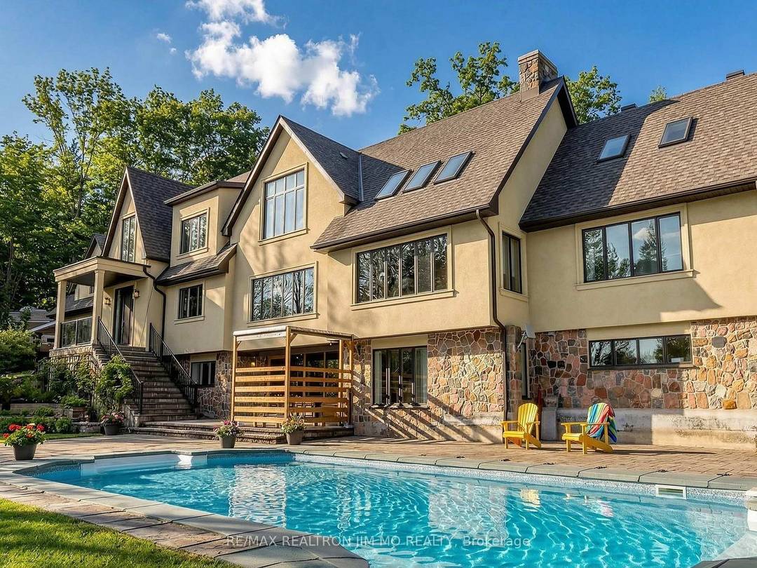 Perched atop a breathtaking hilltop and surrounded by 25 acres of pristine woodland, this spectacularly reimagined estate offers a rare blend of refined luxury and unspoiled natural beauty.