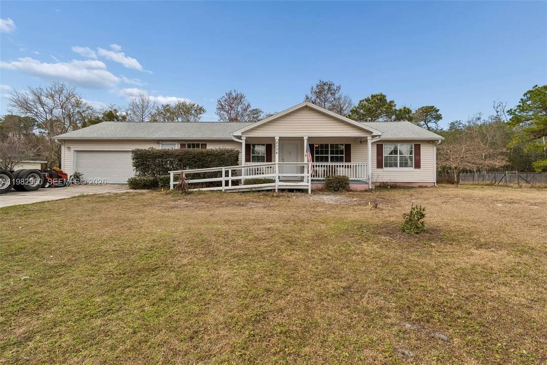 Welcome to this charming single family home situated on just over 3 acres in Orlando, offering space, privacy, and versatility rarely found so close to the city.