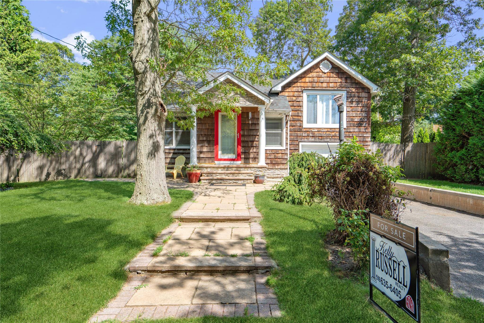 Nestled in a charming North Shore beach community, this delightful three level home offers the perfect retreat for those seeking tranquil coastal living with convenient access to local attractions.