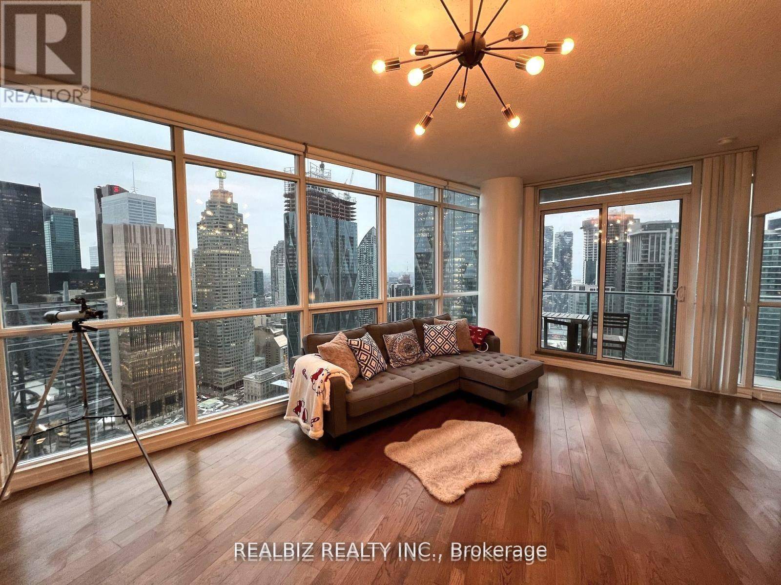 Fully furnished corner unit with breathtaking city and lake views !