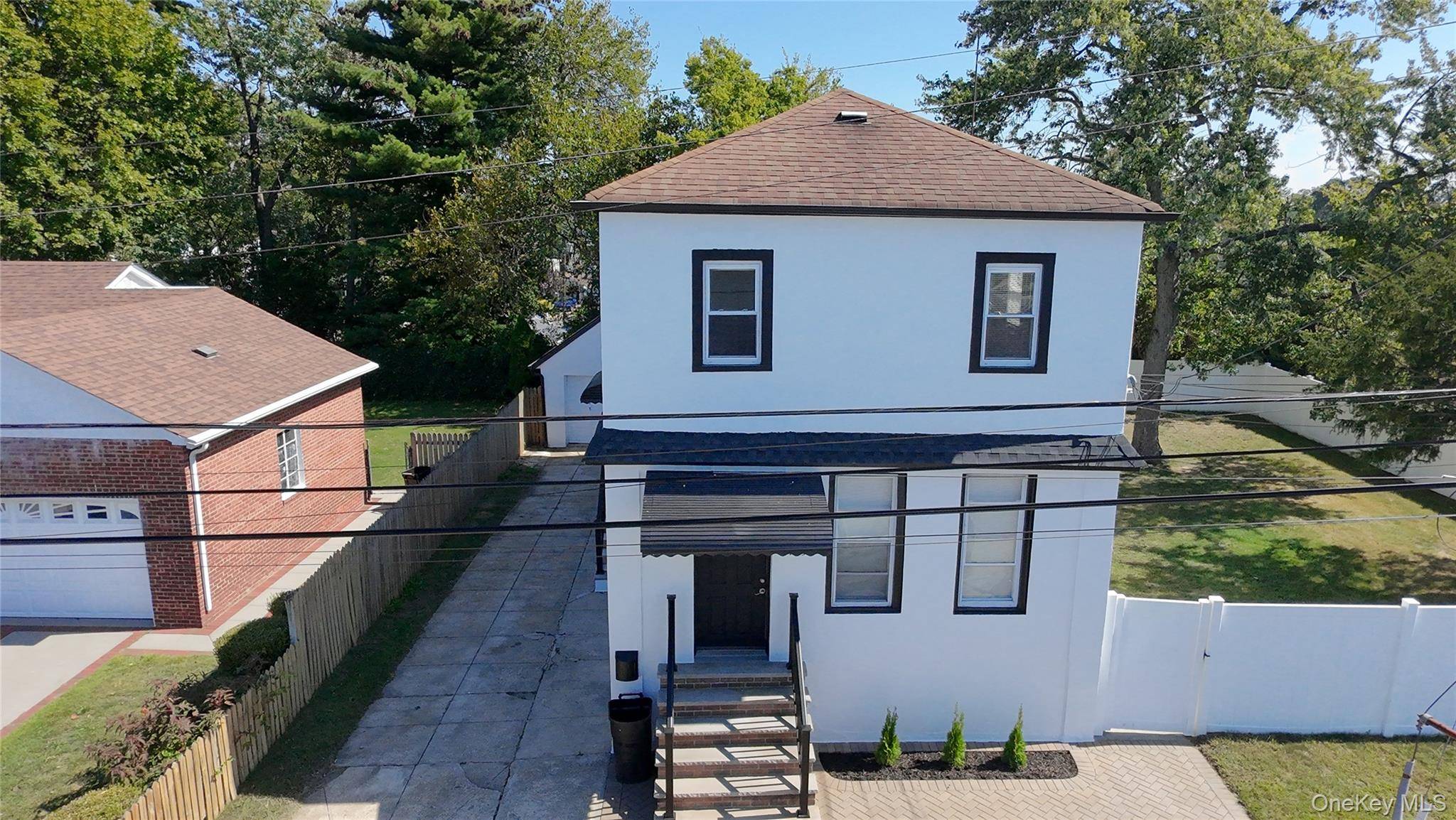 Fully Renovated Legal 2 Family Home on Oversized Lot in Elmont !