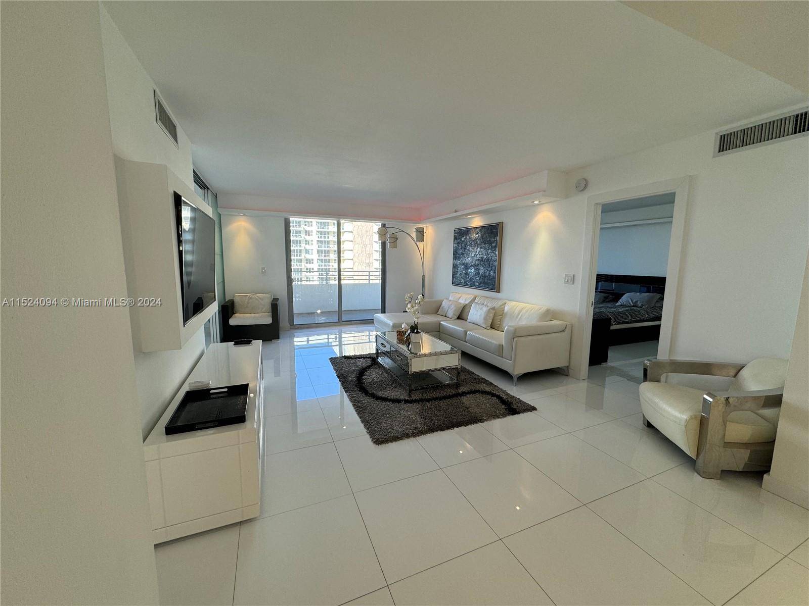 THIS BEAUTIFUL FURNISHED UNIT FEATURES 2 BED 2 BATH AN OPEN KITCHEN AND A LARGE PRIVATE BALCONY.