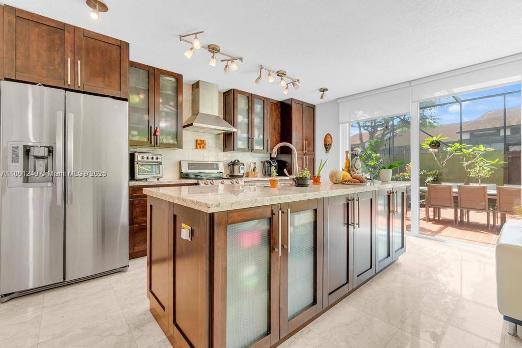 IMPECCABLE Completely Remodeled Townhouse in desirable Calusa Point !