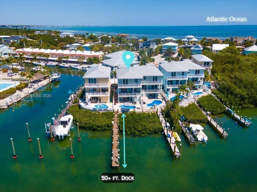 Weekly rental income producing property with open water access and dockage on desirable Sombrero Beach Road.