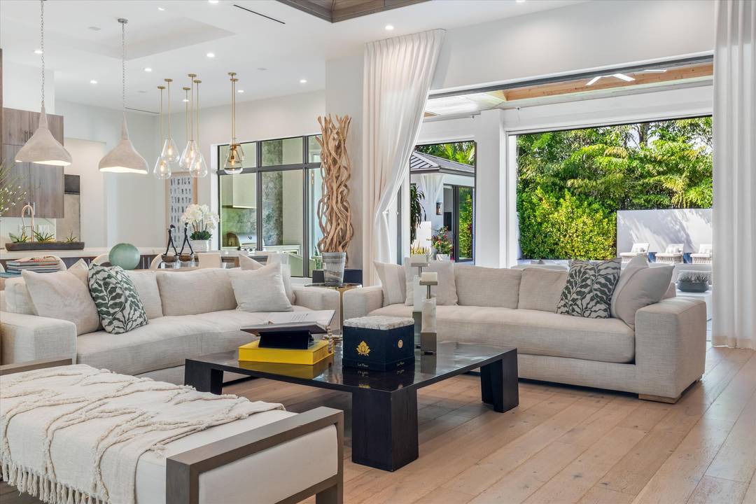 Though it feels worlds away, this luxury home is just minutes from downtown Delray Beach, Atlantic Avenue, pristine beaches, and major highways.