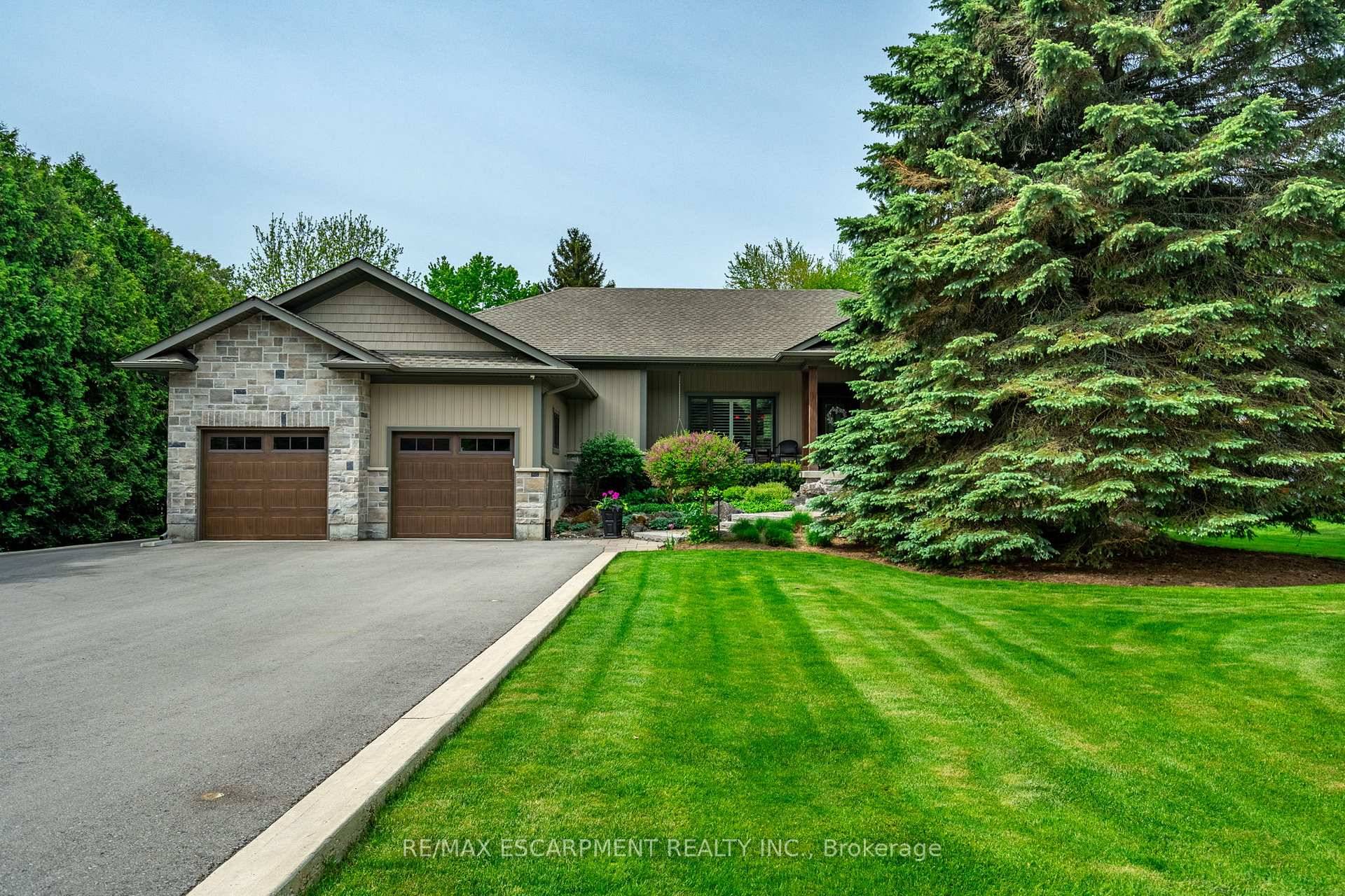 Step inside this beautifully renovated 2, 200 sq ft bungalow and discover coffered ceilings, elegant finishes, and bright, spacious living areas all set on a peaceful 2 acre lot.