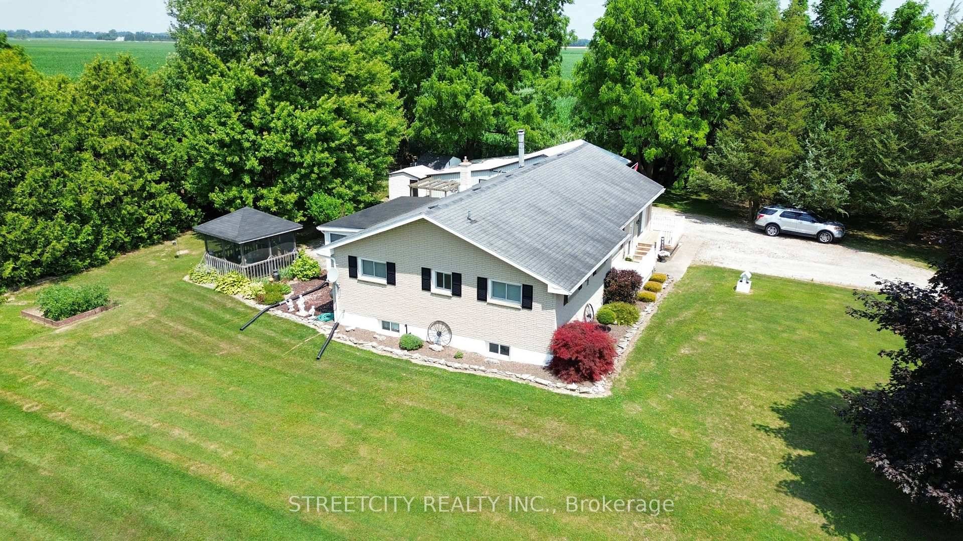 Tucked on a peaceful half acre surrounded by mature trees, this beautifully maintained, custom built raised ranch is ready for your next chapter.