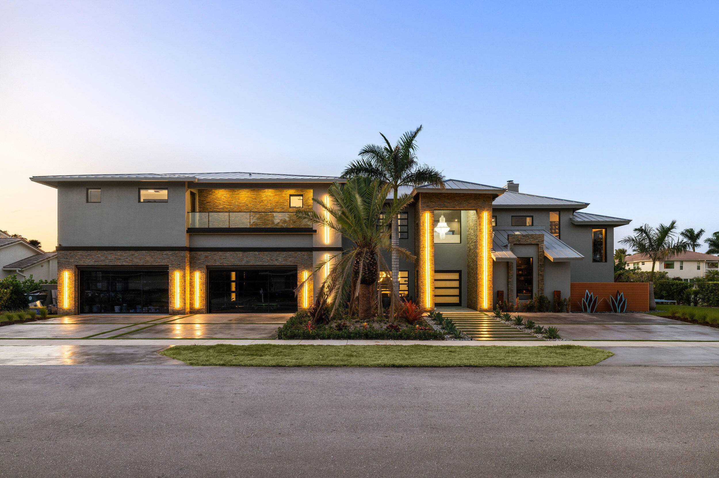 Introducing 839 NE Bay Isle Drive, a breathtaking reimagining of luxury coastal living in the prestigious enclave of Boca Bay Colony.