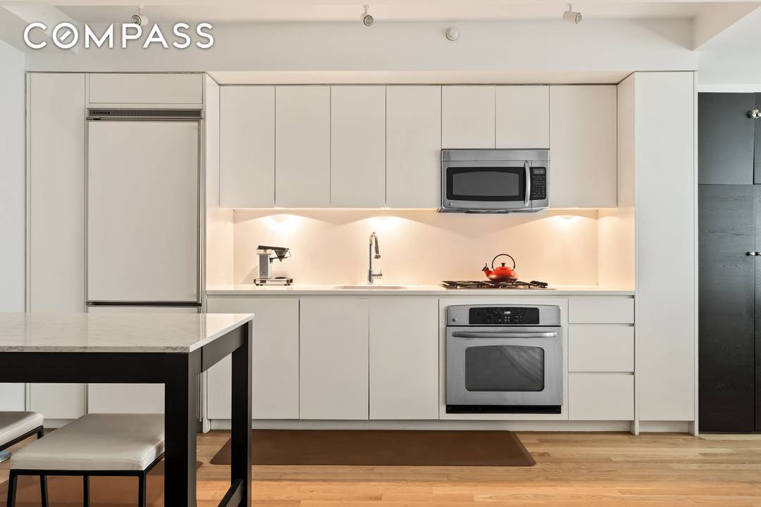 Welcome to Residence 15F, a versatile and sleek 845 square foot loft style apartment that perfectly balances style and functionality.