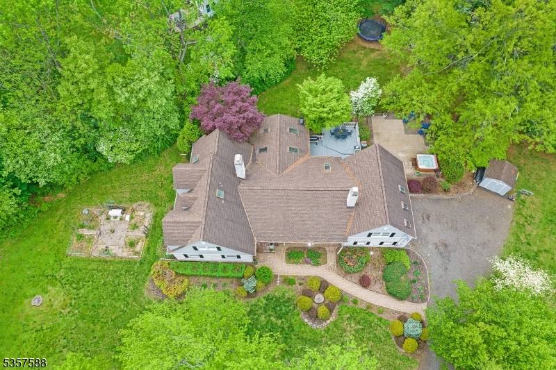 Imagine waking up in your FIRST FLOOR PRIMARY suite, wrapped in light and privacy, in one of Basking Ridge's most sought after neighborhoods.