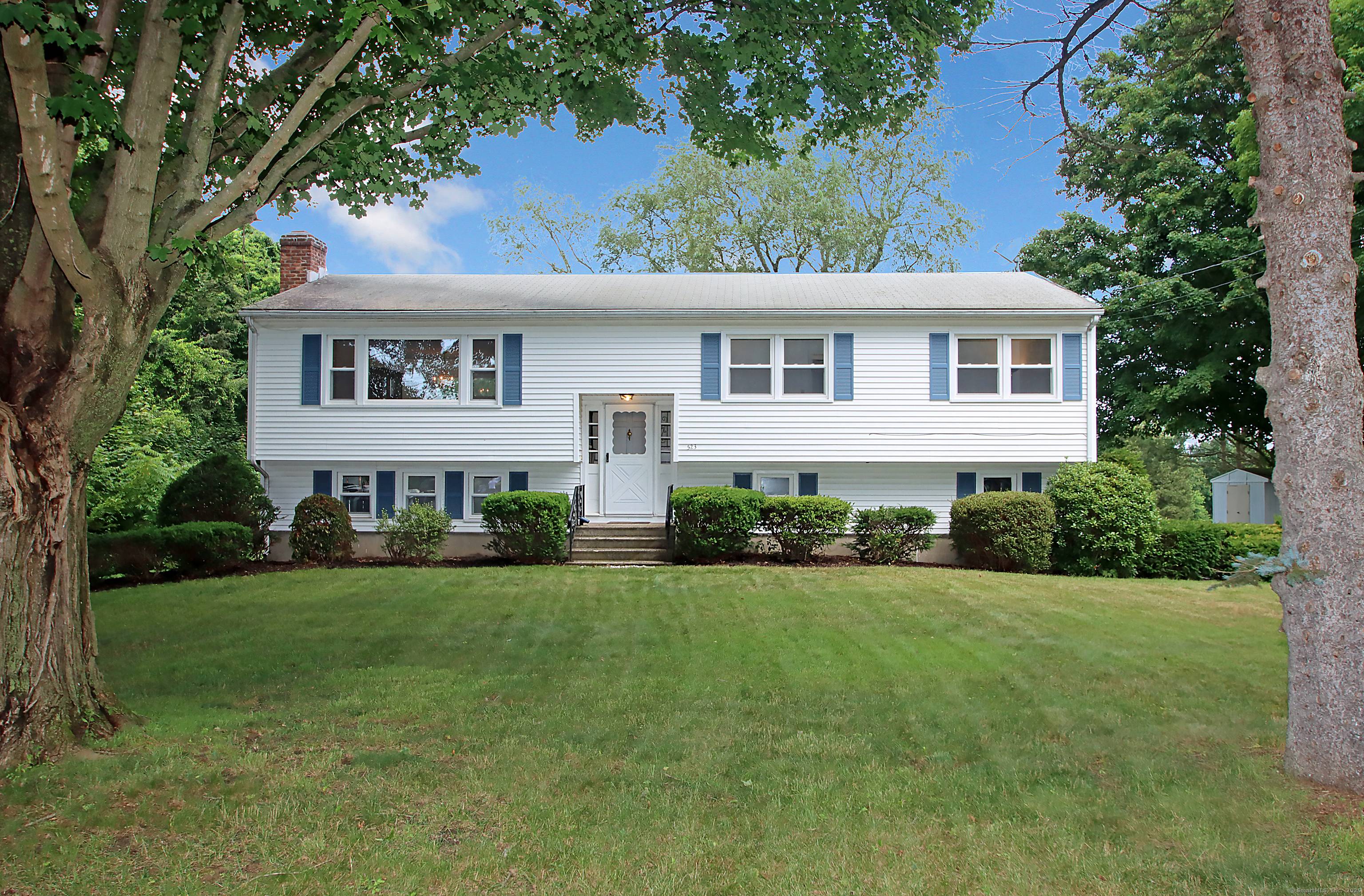 This beautifully maintained raised ranch is serenely set overlooking the 13th green of the Grassy Hill Country Club with mountain views beyond.