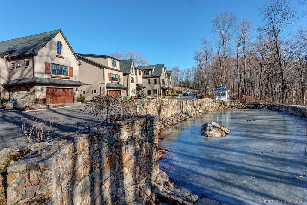 5 Luxury Townhouse Condominiums NESTELED PRIVATELY BEHIND 2614 BOSTON POST ROAD and a short drive to Guilford's Town Center, the Cottage at the Woods transports you to a quaint European ...
