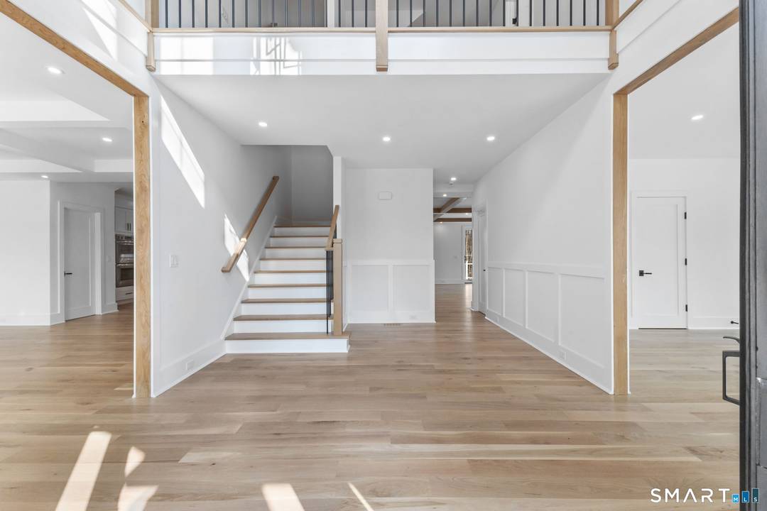 Welcome to 150 Wildwood Road, an exceptional new construction residence that perfectly blends timeless colonial architecture with modern sophistication.