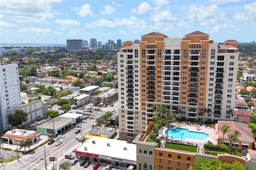 GORGEOUS CORNER UNIT at Gables Marquis featuring two balconies and sweeping views of Coconut Grove on one side, with the Miami skyline and Coral Gables on the other.