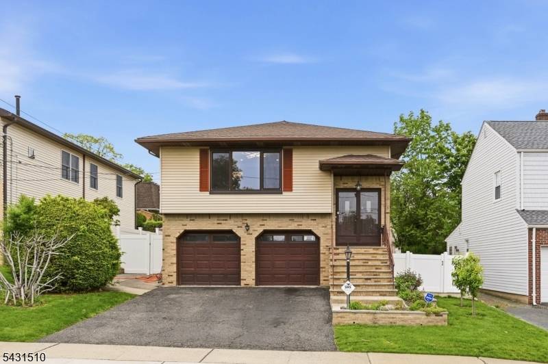 Welcome to this beautiful and bright bi level home, located just two blocks from Fair Lawn.
