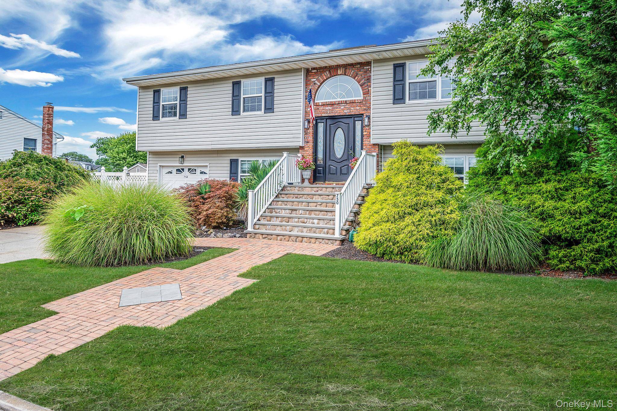 This custom oversized wide line hi ranch with beautiful landscaping is located on quiet dead end street.