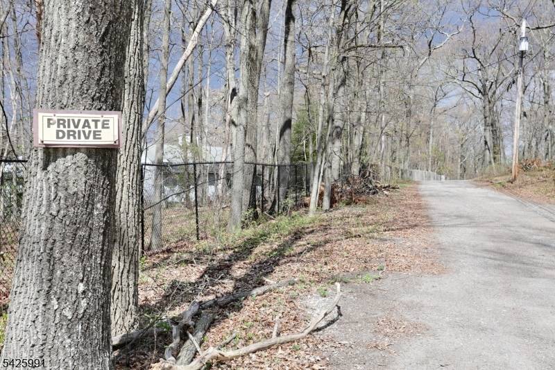 Perched on over two private acres in one of Rockaway Township's most scenic settings, this exceptional estate offers a rare blend of space, versatility, and breathtaking panoramic views stretching to ...